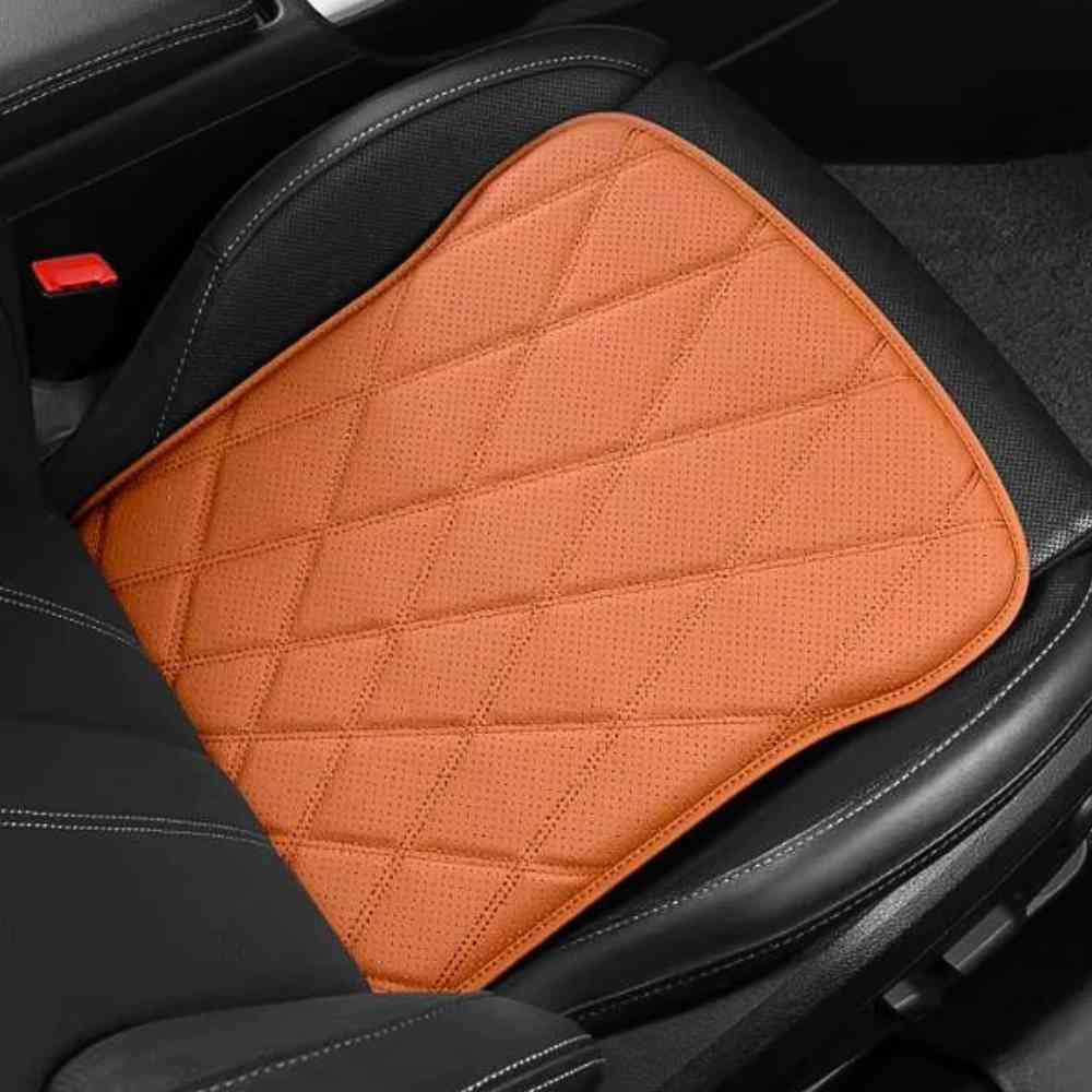 Coussin Voiture Fessier Cuire pu orange sur un siège